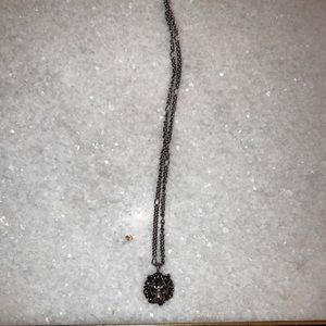 Silver lion Gucci necklace.